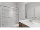 Bathroom with shower and tub combo, single sink vanity, and framed mirror at 89 Grove Township Way, Angier, NC 27501
