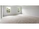 Spacious bedroom with carpet, neutral walls and trim, and lots of natural light at 89 Grove Township Way, Angier, NC 27501