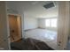 Bright bedroom with large windows, neutral carpet, and an adjacent bathroom at 89 Grove Township Way, Angier, NC 27501