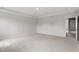 Bright primary bedroom with plush carpet, trey ceiling, and neutral walls at 89 Grove Township Way, Angier, NC 27501