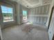 Bright bedroom featuring two large windows for ample natural light at 89 Grove Township Way, Angier, NC 27501