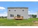 Backyard view of the house with a wooden deck, showing the property's outdoor living space and backyard at 89 Grove Township Way, Angier, NC 27501