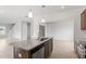 Kitchen island with granite top, stainless steel sink and faucet, and pendant lighting overhead at 89 Grove Township Way, Angier, NC 27501