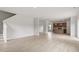 Open floor plan with hardwood floors connecting living room to kitchen, perfect for entertaining at 89 Grove Township Way, Angier, NC 27501