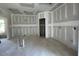Spacious living room featuring sheetrocked walls awaiting personalization and finishing touches at 89 Grove Township Way, Angier, NC 27501