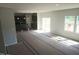Bright and open living room connected to a kitchen with natural light from windows and sliding door at 89 Grove Township Way, Angier, NC 27501