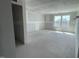 Spacious living room with natural light from many windows at 89 Grove Township Way, Angier, NC 27501