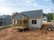 Exterior view of home highlighting a new wooden back porch; great for enjoying the outdoors at 90 Purslane Dr, Franklinton, NC 27525