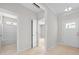Bright entryway showcasing open doorways to bathroom, bedroom and front door at 90 Purslane Dr, Franklinton, NC 27525