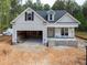 Charming new construction with a two-car garage and bright, airy windows at 90 Purslane Dr, Franklinton, NC 27525