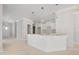 Spacious kitchen featuring white cabinets, modern pendant lighting, and expansive island at 90 Purslane Dr, Franklinton, NC 27525