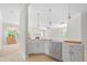 Kitchen adjacent to living room with pendant lighting and new stainless appliances at 90 Purslane Dr, Franklinton, NC 27525