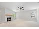 Bright and airy living room with fireplace, shiplap accent wall and large windows at 90 Purslane Dr, Franklinton, NC 27525