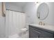 This bathroom includes a vanity with a decorative sink and gold fixtures and a shower with a shower curtain at 106 Teak Cir, Garner, NC 27529