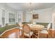 Elegant dining room featuring hardwood floors, neutral walls, and a classic chandelier at 106 Teak Cir, Garner, NC 27529
