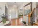 Bright foyer features hardwood floors, chandelier, and views into adjacent rooms, enhancing the home's welcoming ambiance at 106 Teak Cir, Garner, NC 27529