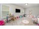 Spacious playroom featuring a variety of toys, games, and comfortable seating areas at 106 Teak Cir, Garner, NC 27529