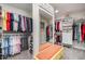 Spacious walk-in closet with ample storage space, shelving, and a seating area at 106 Teak Cir, Garner, NC 27529