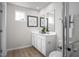 Modern bathroom features a double sink vanity, large mirror, and plenty of counter space at 107 Port Charlotte Ct, Sanford, NC 27330
