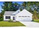 Charming single-story home with a well-manicured lawn, attached garage, and inviting curb appeal at 107 Port Charlotte Ct, Sanford, NC 27330