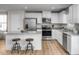 Modern kitchen featuring an island with seating, stainless steel appliances, and stylish countertops at 107 Port Charlotte Ct, Sanford, NC 27330