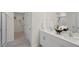A well-lit bathroom features a double sink vanity and a glass-enclosed shower at 1105 Ursa Major Ct, Wendell, NC 27591