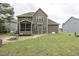 Expansive backyard with a well-maintained lawn and a screened-in porch on the house at 1108 Agio Ct, Zebulon, NC 27597