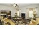 Elegant living room with fireplace, large windows, and decorative seating at 1108 Agio Ct, Zebulon, NC 27597