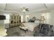 Bright main bedroom with a tray ceiling, ornate furniture, and a ceiling fan at 1108 Agio Ct, Zebulon, NC 27597