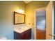 Half bathroom featuring neutral walls and a decorative mirror above the sink at 113 Laurel Branch Dr, Cary, NC 27513