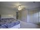 Bedroom featuring a ceiling fan, double closets and neutral carpet at 113 Laurel Branch Dr, Cary, NC 27513