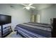 Spacious bedroom with a ceiling fan, plush carpet, and a queen sized bed at 113 Laurel Branch Dr, Cary, NC 27513