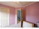 Bedroom featuring a doorway to the stairwell and double closets at 113 Laurel Branch Dr, Cary, NC 27513