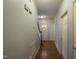 Hallway featuring hardwood floors, neutral walls, and views of the front door and staircase at 113 Laurel Branch Dr, Cary, NC 27513