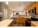 Traditional kitchen with wooden cabinets, stainless steel appliances, and an eat-in island at 113 Laurel Branch Dr, Cary, NC 27513