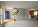 Open floor plan with hardwood and carpet floors, leading to a formal dining room area at 113 Laurel Branch Dr, Cary, NC 27513