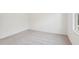 Bedroom with neutral carpet, white walls, and a bright window at 115 Gladstone Loop, Clayton, NC 27520