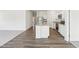 Kitchen island with stone countertops, stainless appliances and hard wood flooring throughout at 115 Gladstone Loop, Clayton, NC 27520