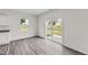Dining area with hardwood floors and sliding glass door leading to backyard at 129 Gladstone Loop, Clayton, NC 27520