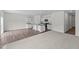 This open-concept living space features hardwood floors, carpet and a kitchen with white cabinets and granite countertops at 131 N Keatts Winner Ct, Wilson's Mills, NC 27520