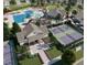 Aerial view of community pool, clubhouse, tennis courts, and pickleball courts at 133 Gladstone Loop, Clayton, NC 27520