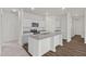 Kitchen showcasing granite countertops, white cabinets, and stainless steel appliances in a modern design at 133 Gladstone Loop, Clayton, NC 27520