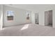 Spacious primary bedroom boasts two bright windows and an ensuite bathroom entrance at 133 Gladstone Loop, Clayton, NC 27520