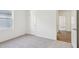 A bright bedroom with neutral carpet, white walls, and a window provides a serene, minimalist feel at 137 Gladstone Loop, Clayton, NC 27520