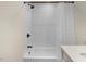 Bathroom featuring subway tile, shower with curtain and modern fixtures at 1518 Echo Rd, Durham, NC 27707