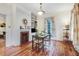 Bright dining room features hardwood floors, fireplace and natural light at 1518 Echo Rd, Durham, NC 27707