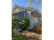 Charming home featuring gray siding, white trim, and lush landscaping creating an inviting curb appeal at 1518 Echo Rd, Durham, NC 27707