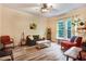 Living room featuring wood floors, fireplace and plenty of natural light at 1518 Echo Rd, Durham, NC 27707