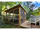 Screened-in patio with deck and outdoor dining area at 1518 Echo Rd, Durham, NC 27707