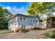 Spacious backyard featuring a stone patio, lush landscaping, and a screened-in porch, perfect for outdoor living at 1518 Echo Rd, Durham, NC 27707